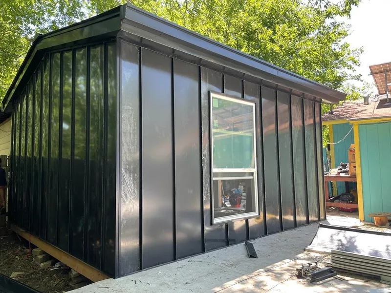 Black standing seam metal wall panels for Metal Roof Installation in Linton